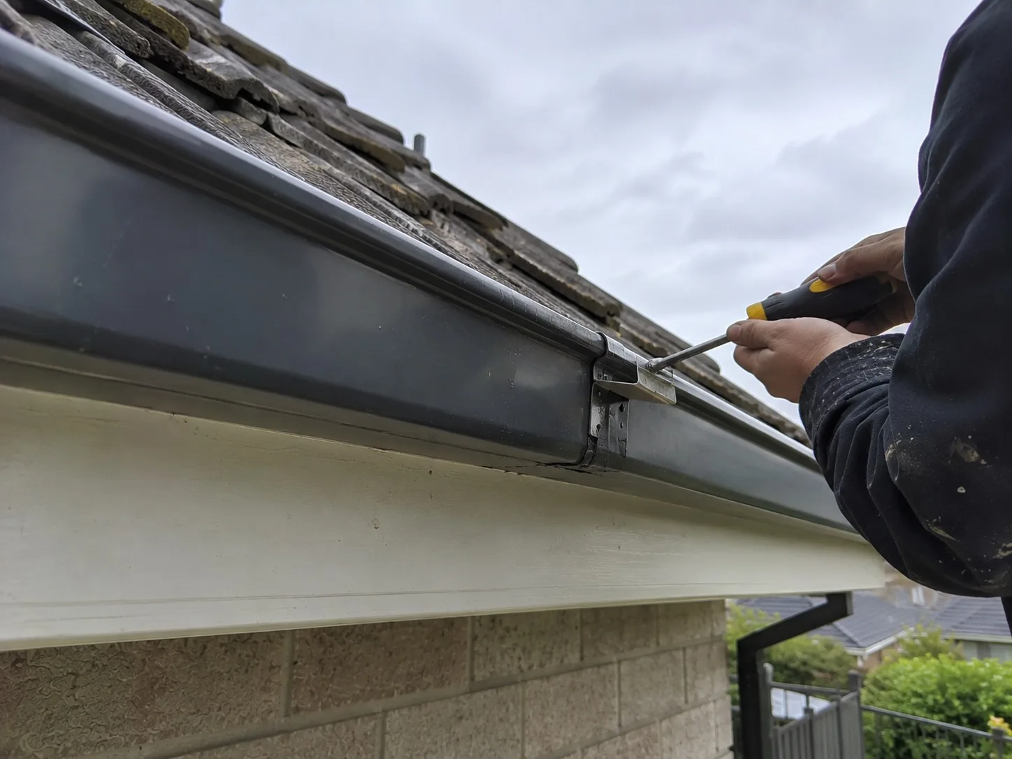 Gutters and downpipes draining roof water on a West Auckland home