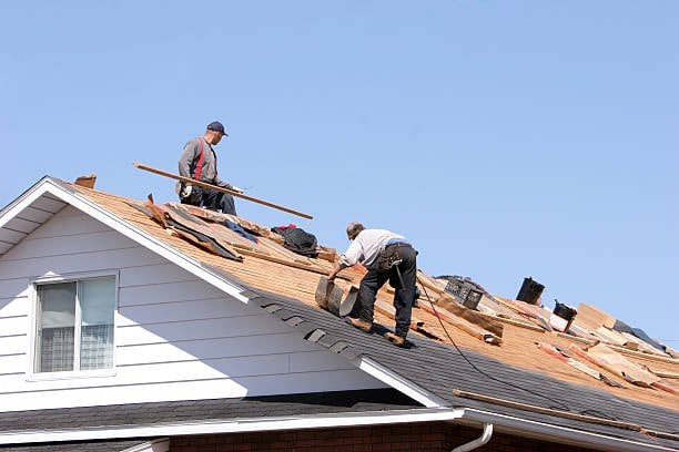 Roofing contractors at work